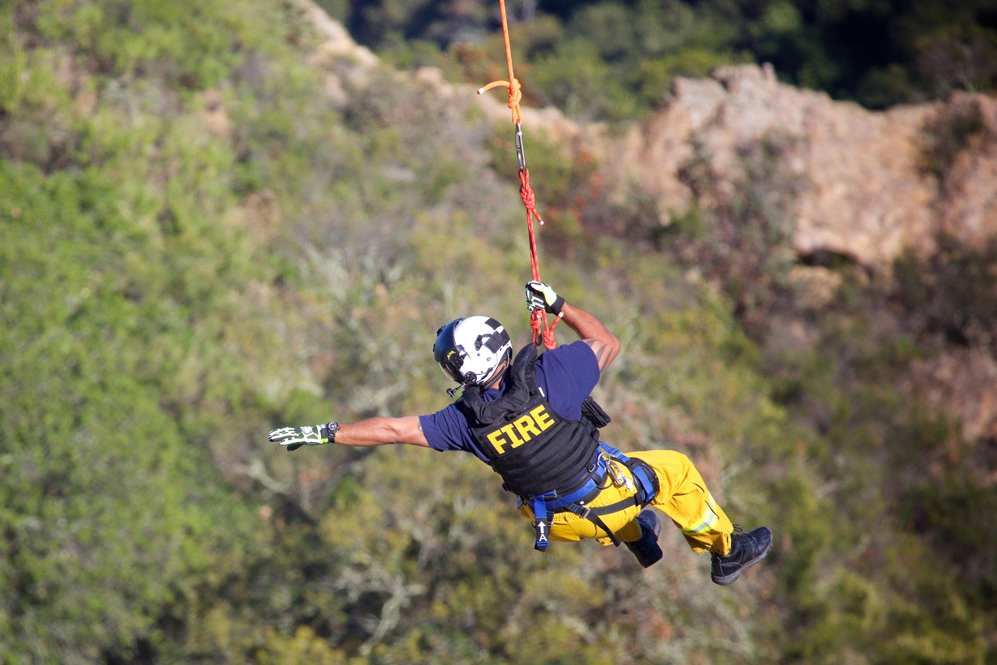 A rescuer suspended from a helicopter - innovative search and rescue technology transforming the landscape of lifesaving missions